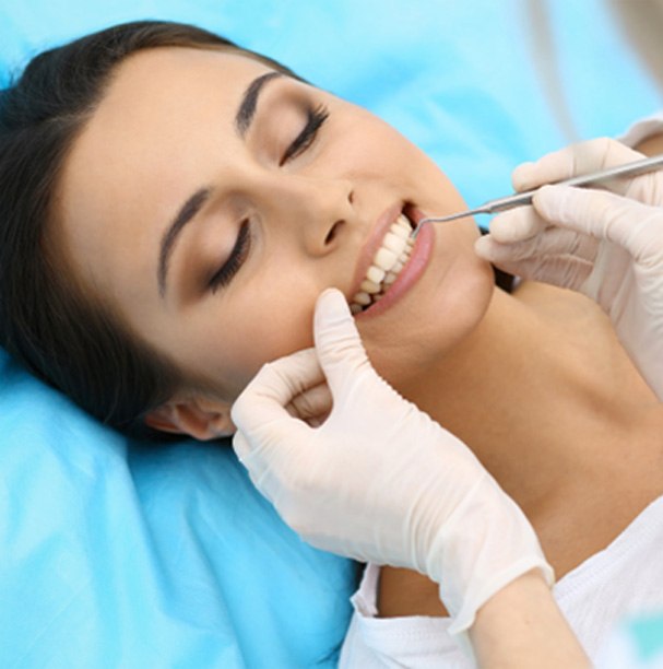 Woman at cosmetic dentistry consultation