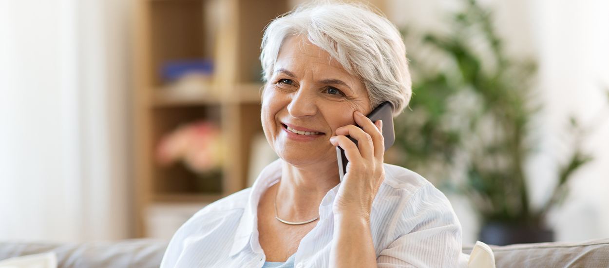 woman smiling talking on phone