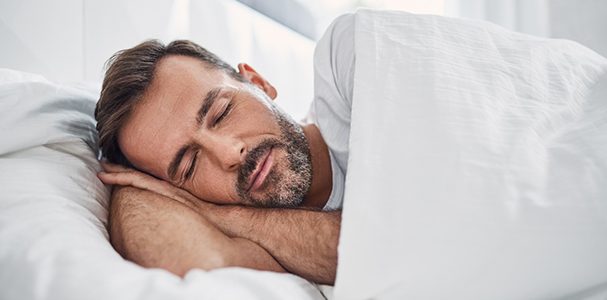 Man sleeping in a bed