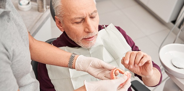 Man at the dentist with dentures