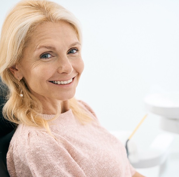 Woman smiling in the dental chair