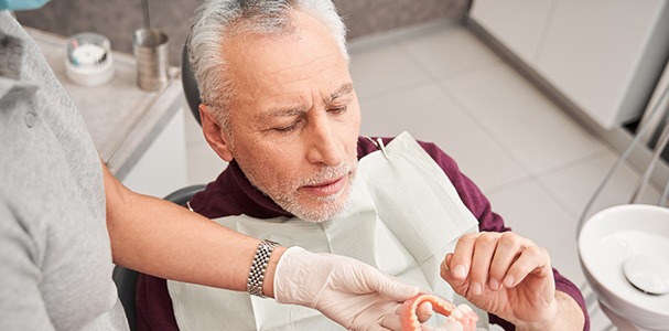 Man at the dentist getting dentures