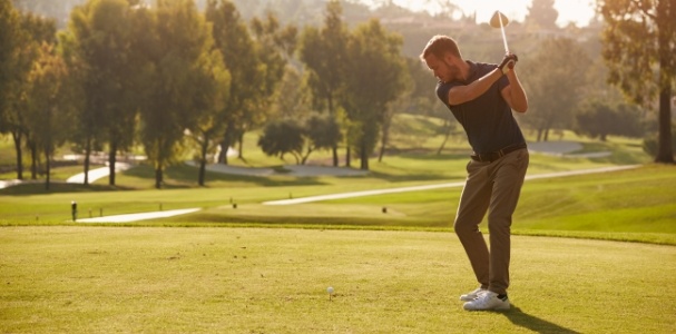 man golfing outside