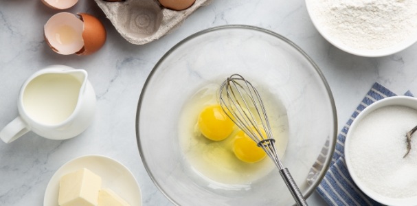 whisk on bowl of eggs