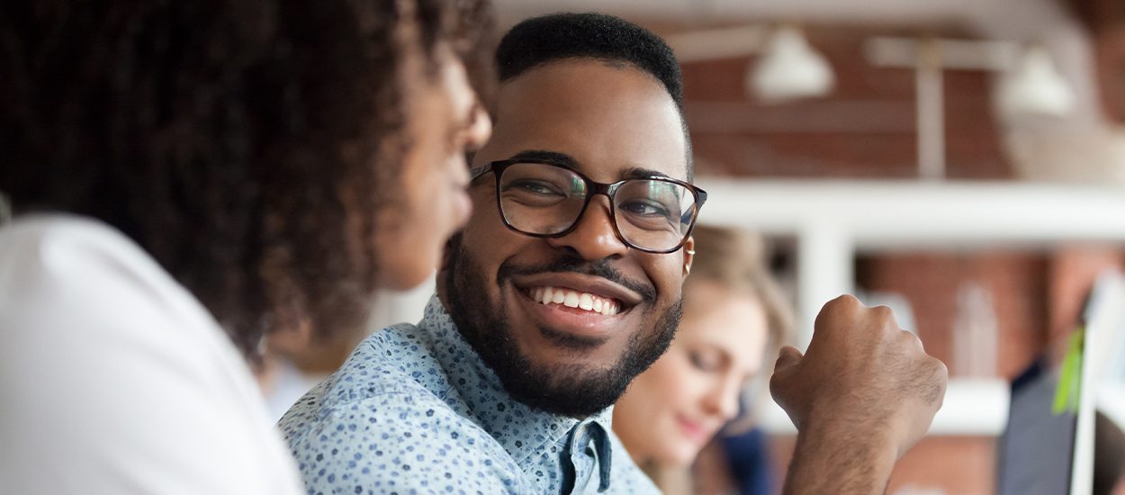 man smiling at girlfriend