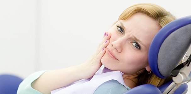 girl looking at camera in pain