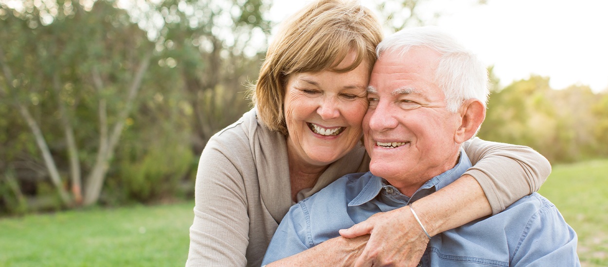 Couple hugging and smiling