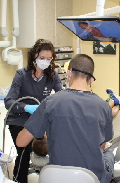 Dentistry of Wisconsin team members working on patient