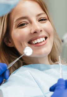 patient smiling while visiting dentist 