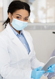 patient smiling while visiting dentist 