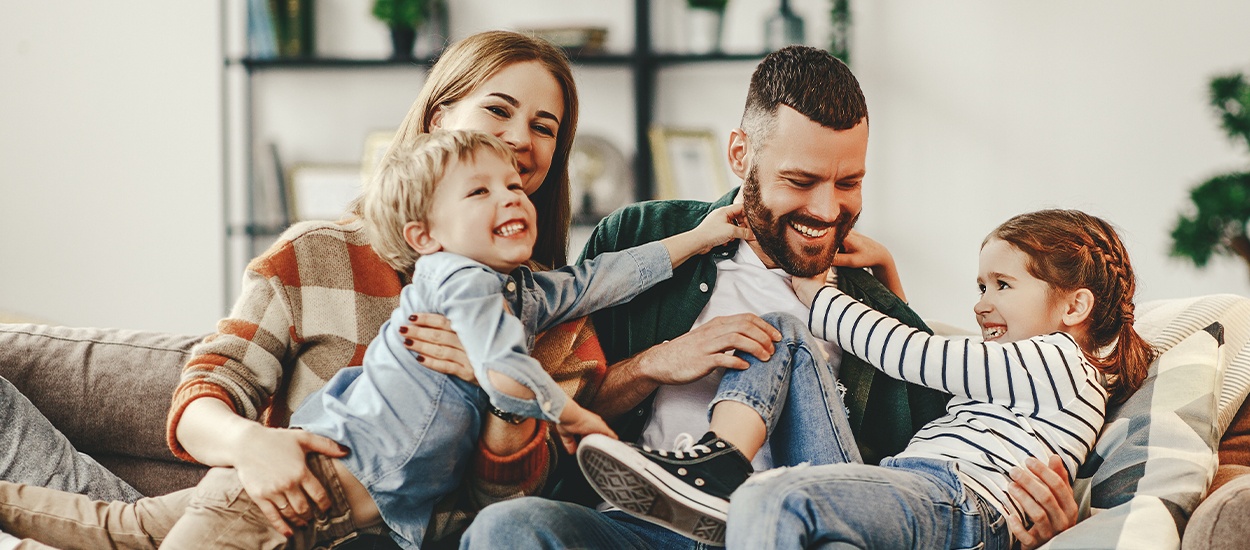 family of four playing together