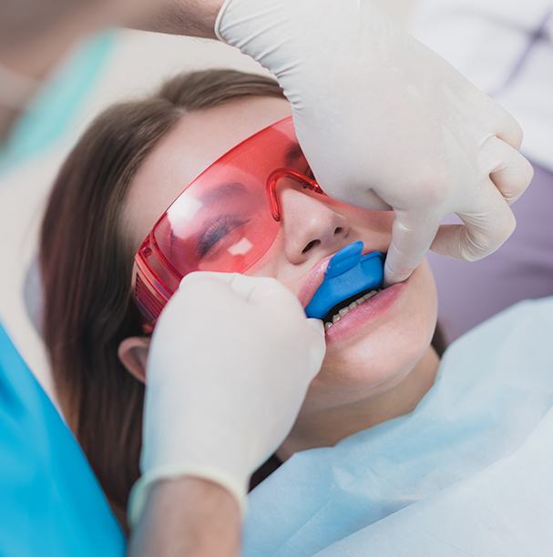 girl getting fluoride treatment