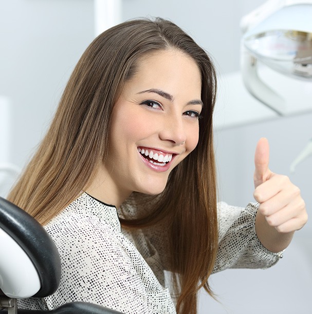 young woman doing thumbs up