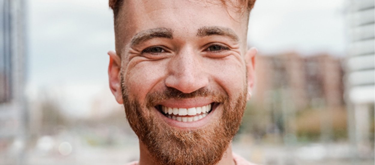 Bearded man smiling after dental implant salvage in Waupun, WI