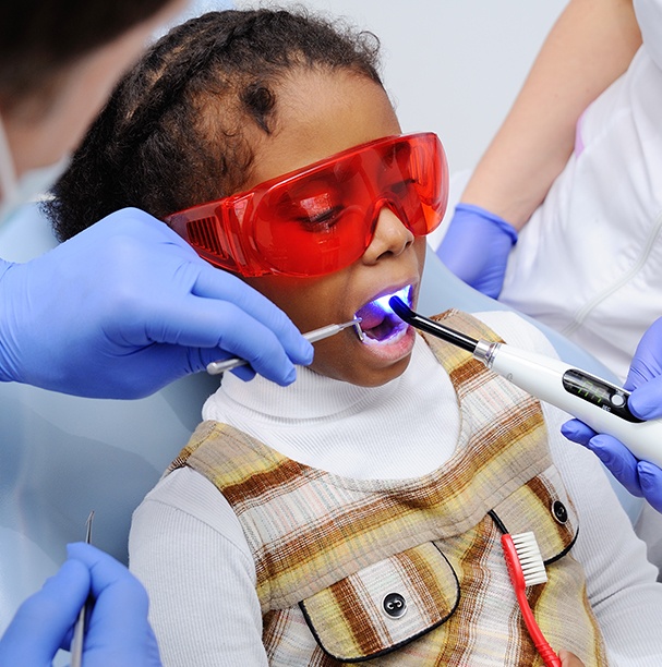 young girl getting dental sealants