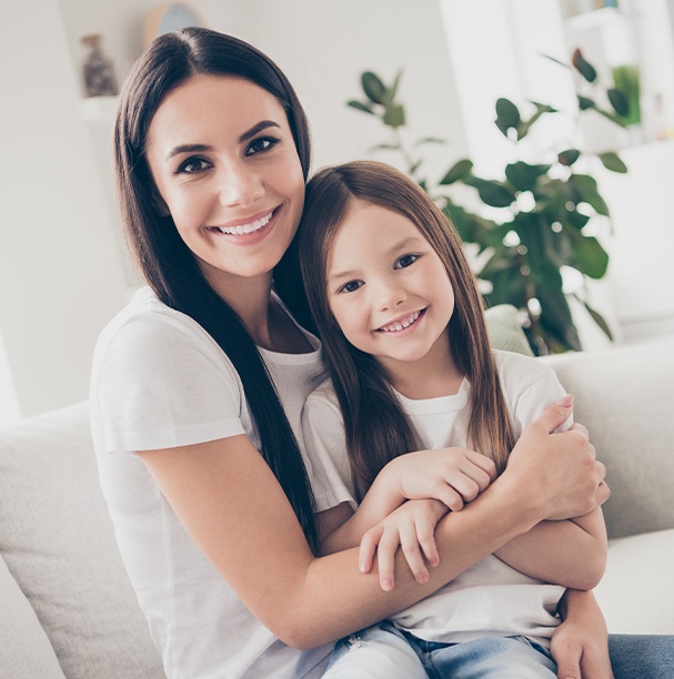 mother and daughter smiling