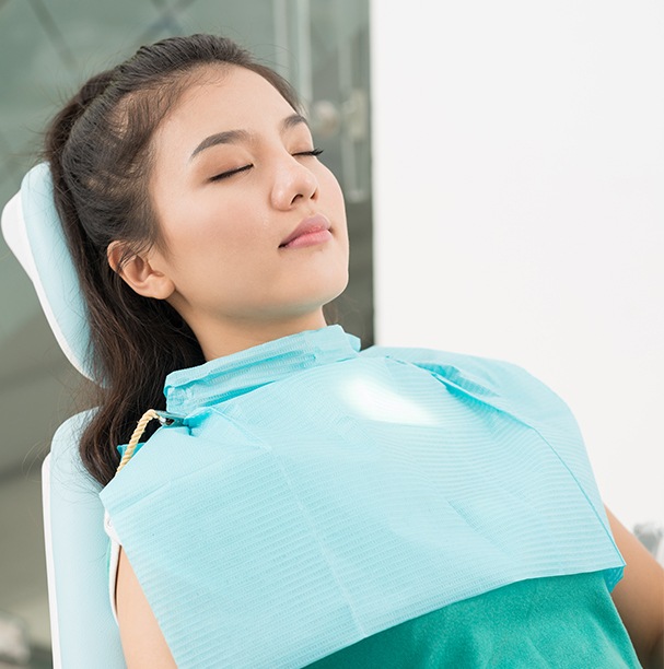 woman sedated in exam chair