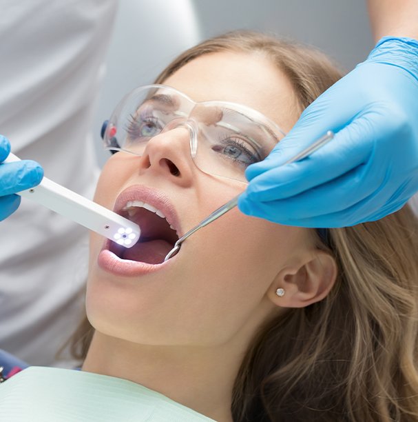 dentist using intraoral camera