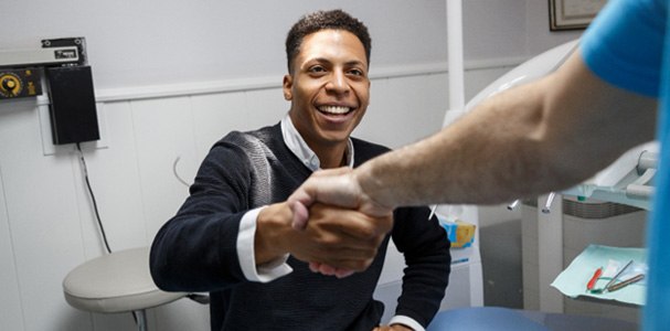 Man shaking a dentist’s hand after receiving veneers in Waupun & Beaver Dam, WI