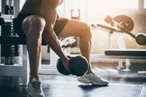 Man exercising by lifting a weight