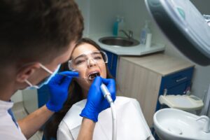 Dentist performing root canal therapy.